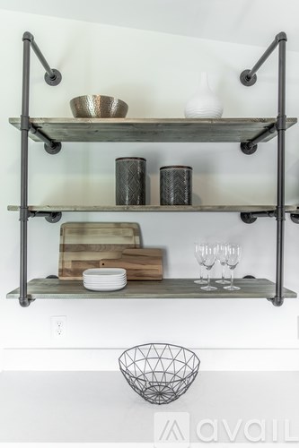 A metal shelf with various items on it.