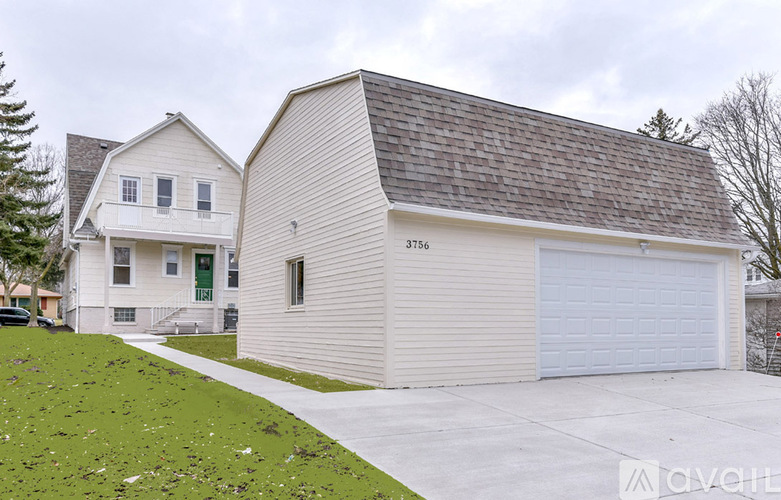 A two-story house with a detached garage.