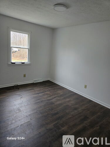 A room with a Galaxy S24+ logo on the floor.