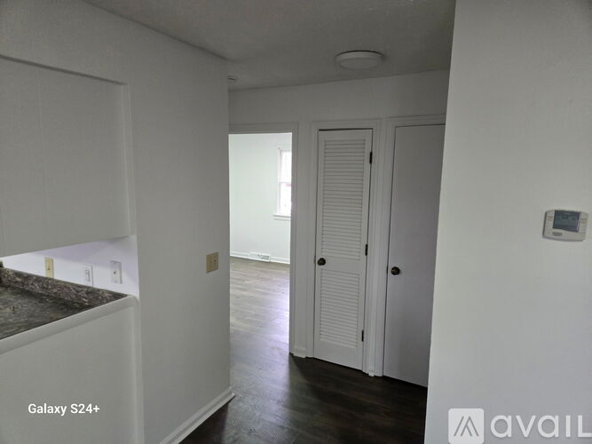 A room with a door and a window.