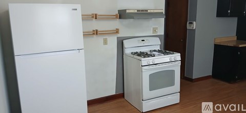 A white fridge and stove in a kitchen.