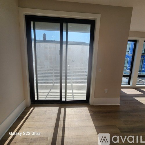 A room with a Galaxy S22 Ultra smartphone on the floor.