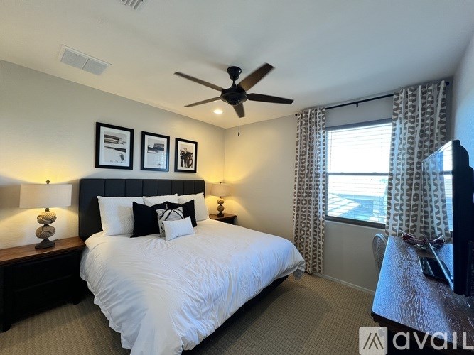 A bathroom with a toilet, sink, and shower.