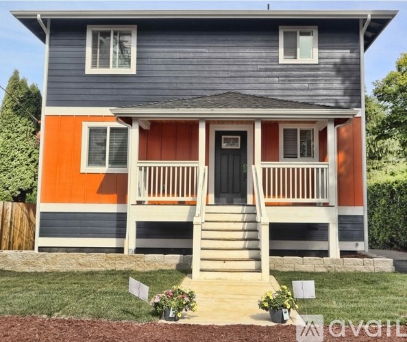A bedroom with a large bed and two nightstands.