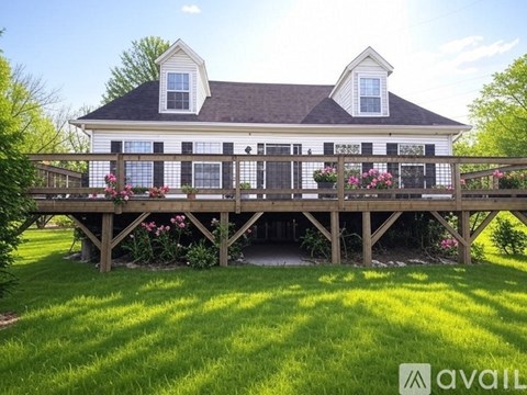 A house with a deck and flowers.