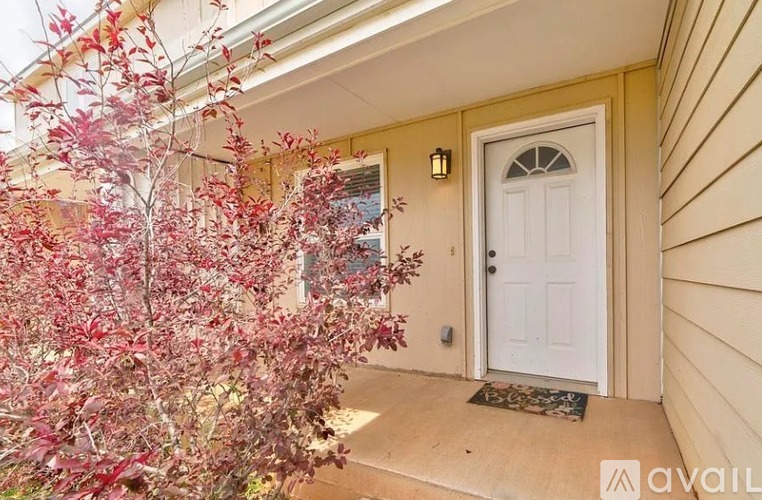 A white door is on the right side of the image.