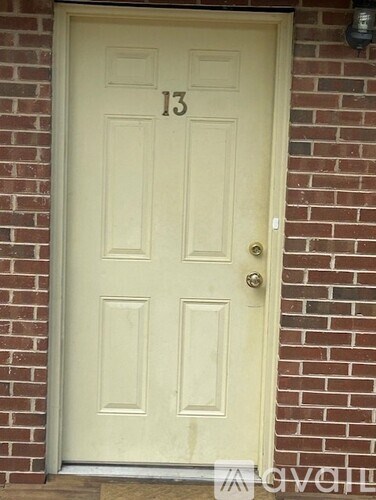 A white door with the number 13 on it.