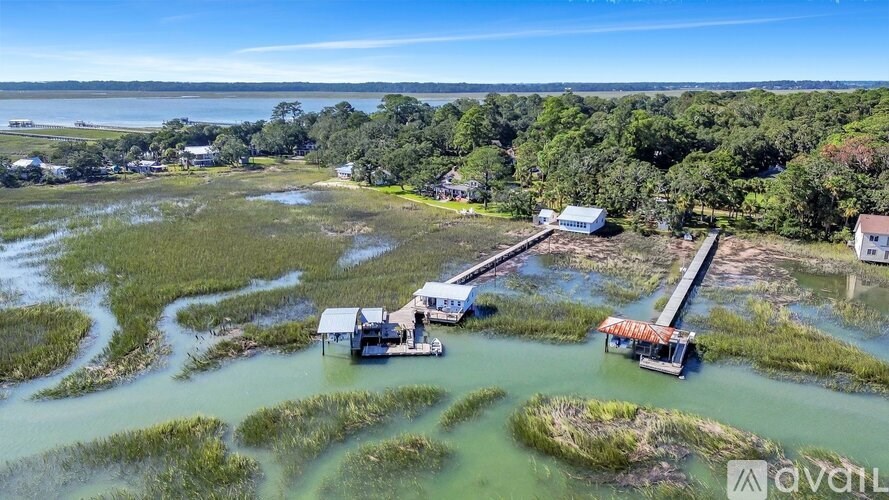 A bird's eye view of a marina with boats docked at the pier.