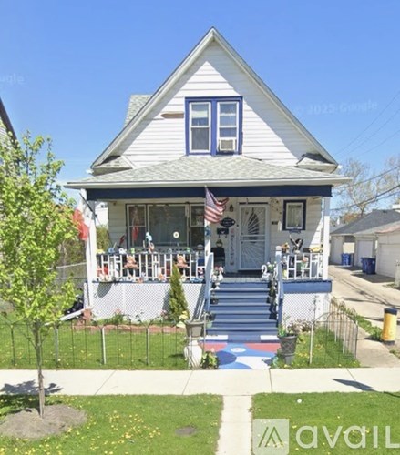 A house with a flag on the front porch.