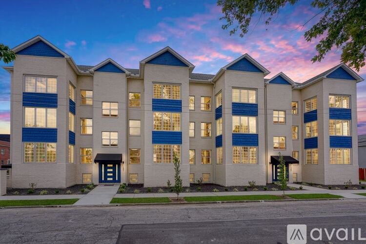 A building with a blue and white facade is available for rent.