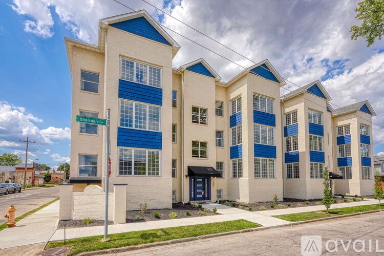 A modern building with blue trim and windows is for sale.