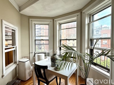 A kitchen with a stove, oven, and microwave.