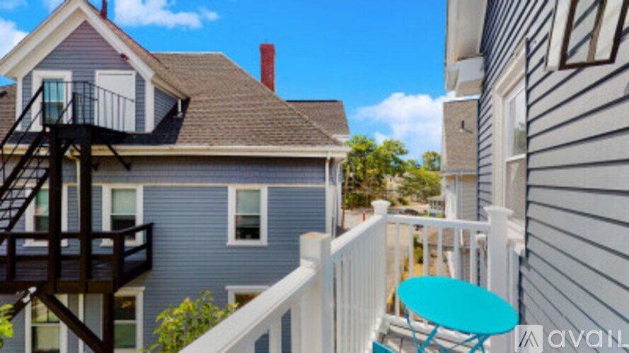 A house with a balcony and a table.