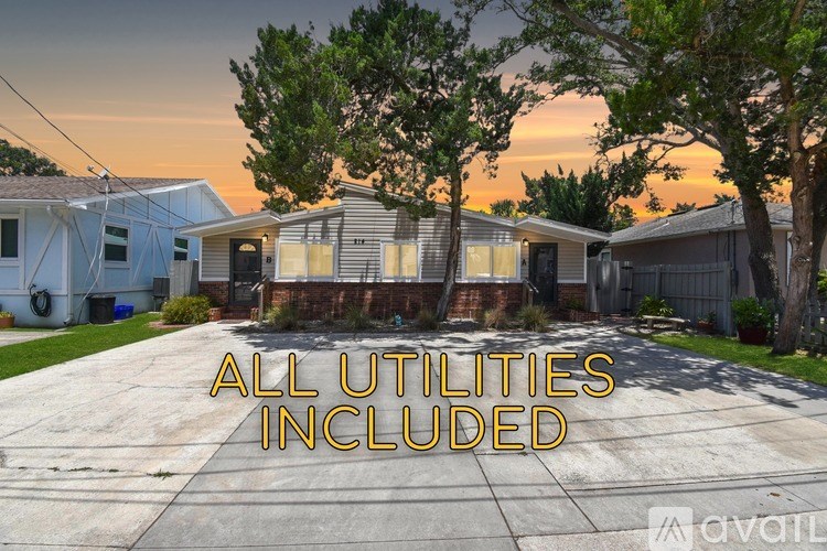 A sunset view of a house with the text "ALL UTILITIES INCLUDED" in the foreground.