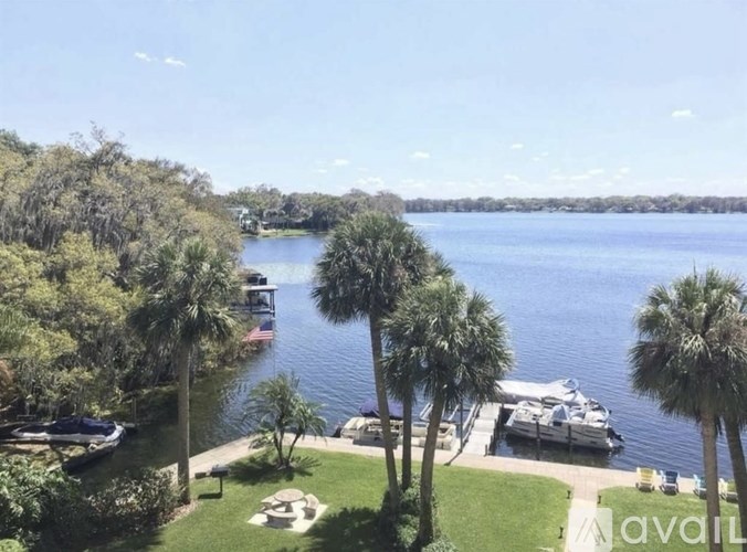 A view of a lake with boats docked at a marina.