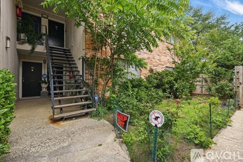 A house with a sign that says "No Parking" in front of it.