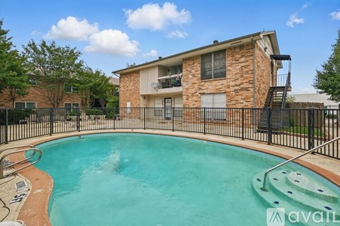 A house with a pool in the backyard.