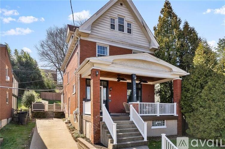 A house with a porch and a covered entrance.