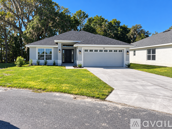 A house with a garage is available for sale.