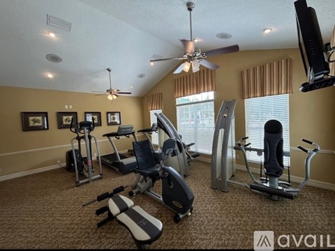 A well-equipped home gym with a variety of exercise machines.