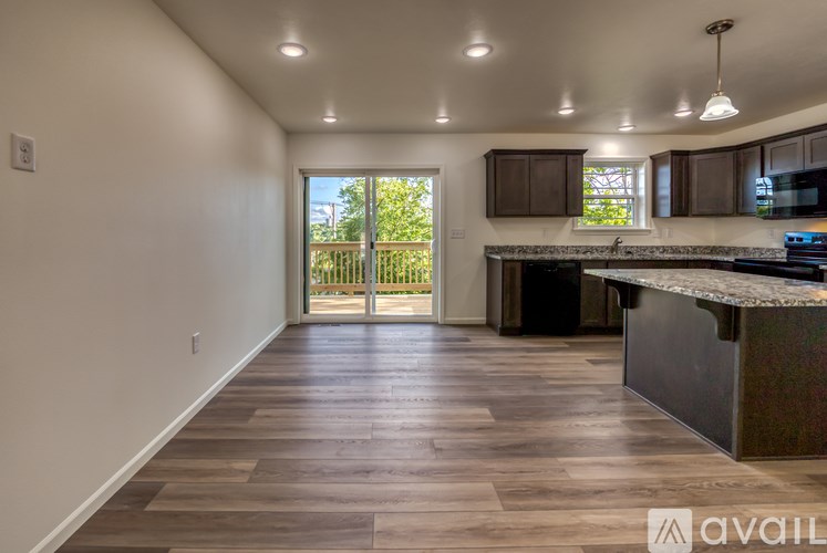 A kitchen with a countertop and cabinets is available for rent.