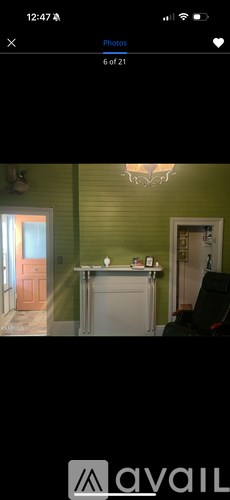 A room with green walls and a white door.
