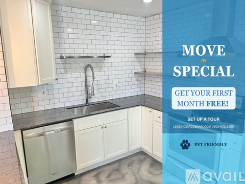 A kitchen with a dishwasher, sink, and cabinets is on sale for the first month free.