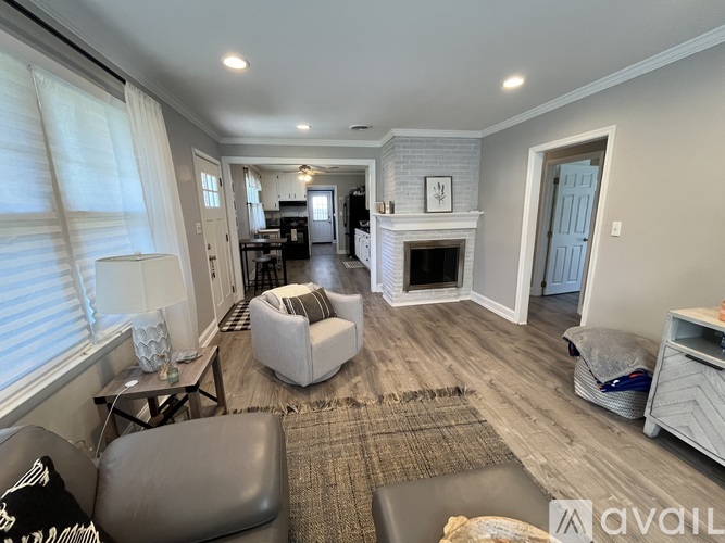 A living room with a fireplace and a couch.