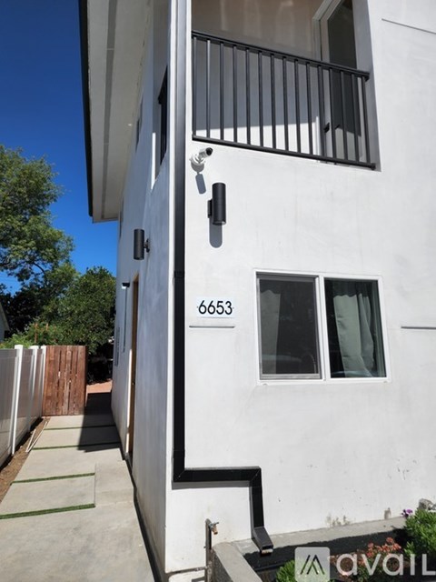 A white building with the number 6653 on it.