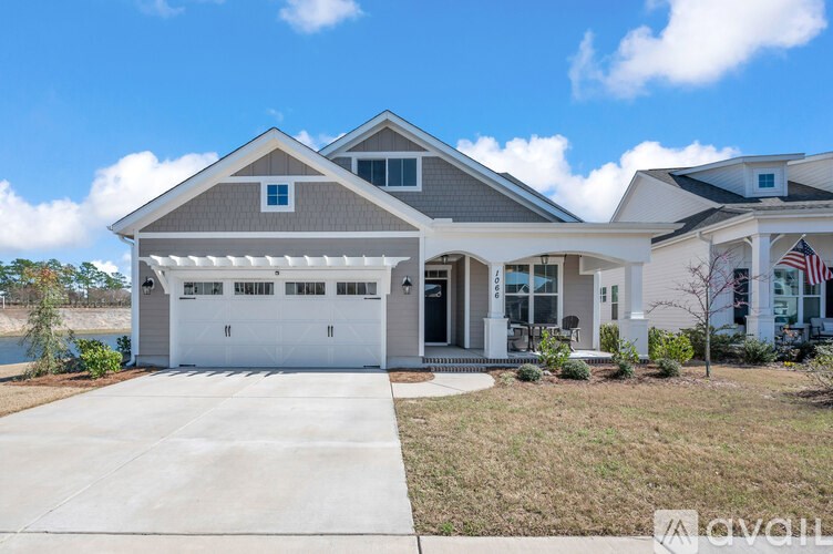 A house with a garage is available for sale.