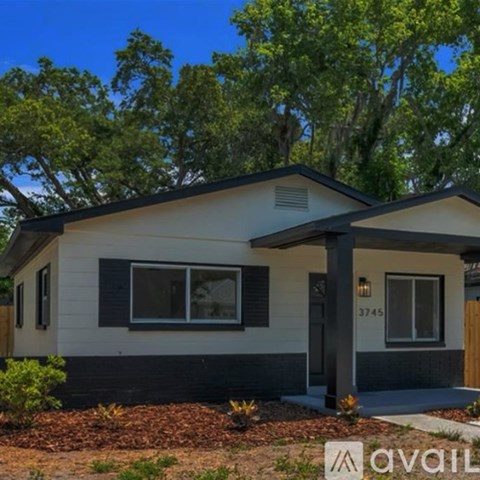 A house with the number 3745 on it is for sale.