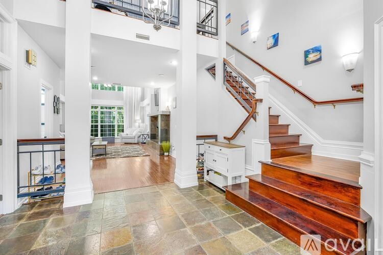 A large open space with a staircase leading to the upper floor.