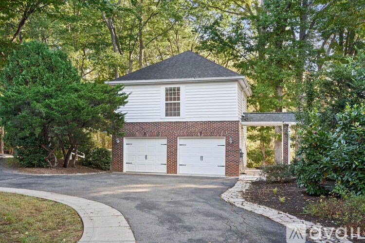 A two-car garage is attached to a house.
