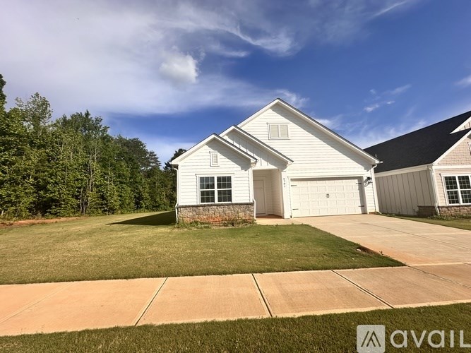 A house with a garage is for sale.