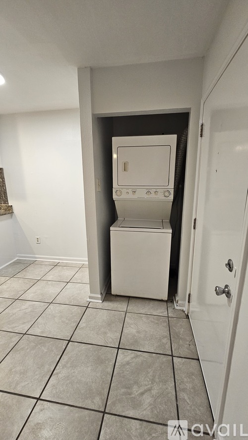 A white oven and microwave in a kitchen.