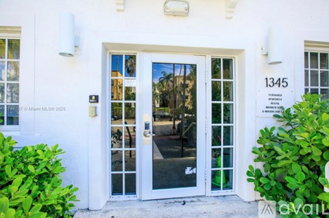 The front door of a building with the number 1345 on it.
