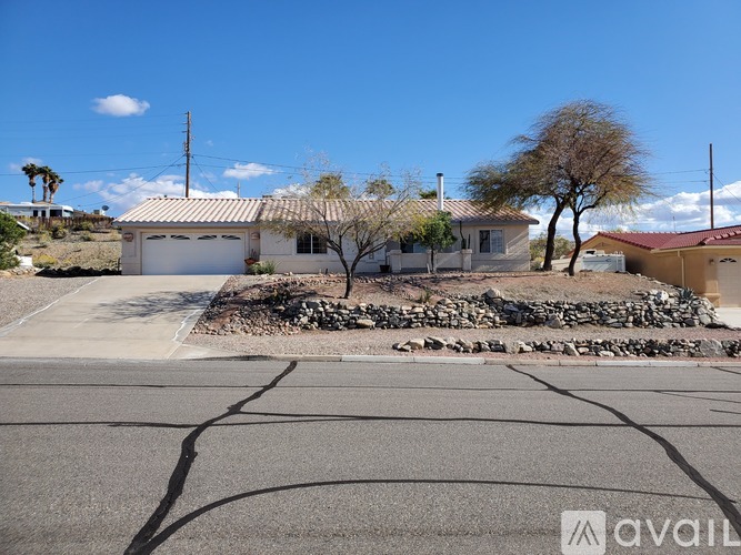 A house with a white garage door is for sale.