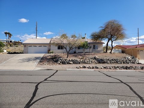 A house with a white garage door is for sale.