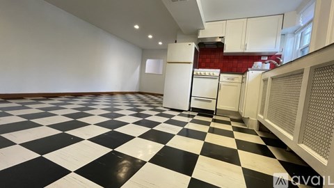 A black and white checkered floor in a kitchen.