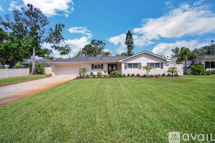 A house with a lawn in front of it is for sale.