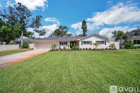 A house with a lawn in front of it is for sale.