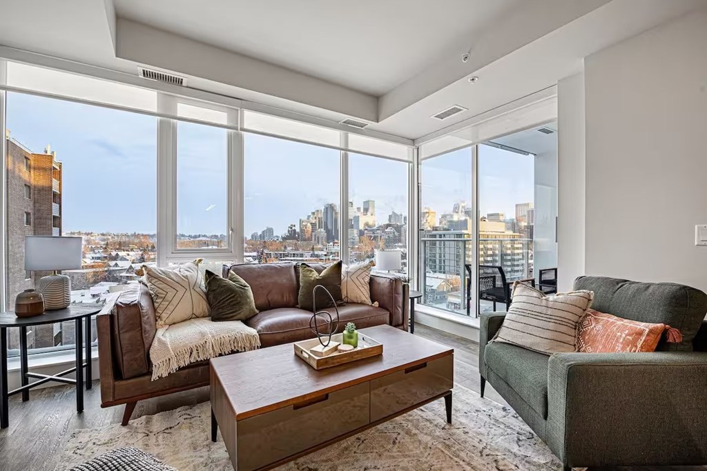 A living room with a view of the city.