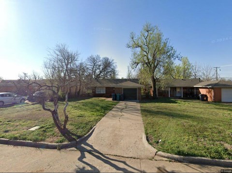 A residential area with houses and trees.