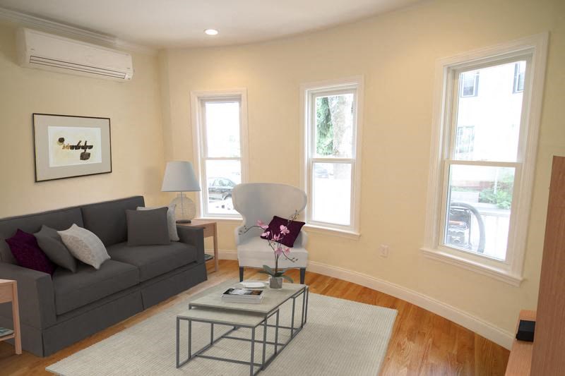 a living room with a couch and a table
