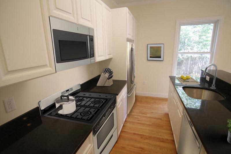 a kitchen with a stove and a microwave