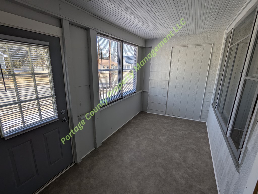 A room with a window and a door is shown.