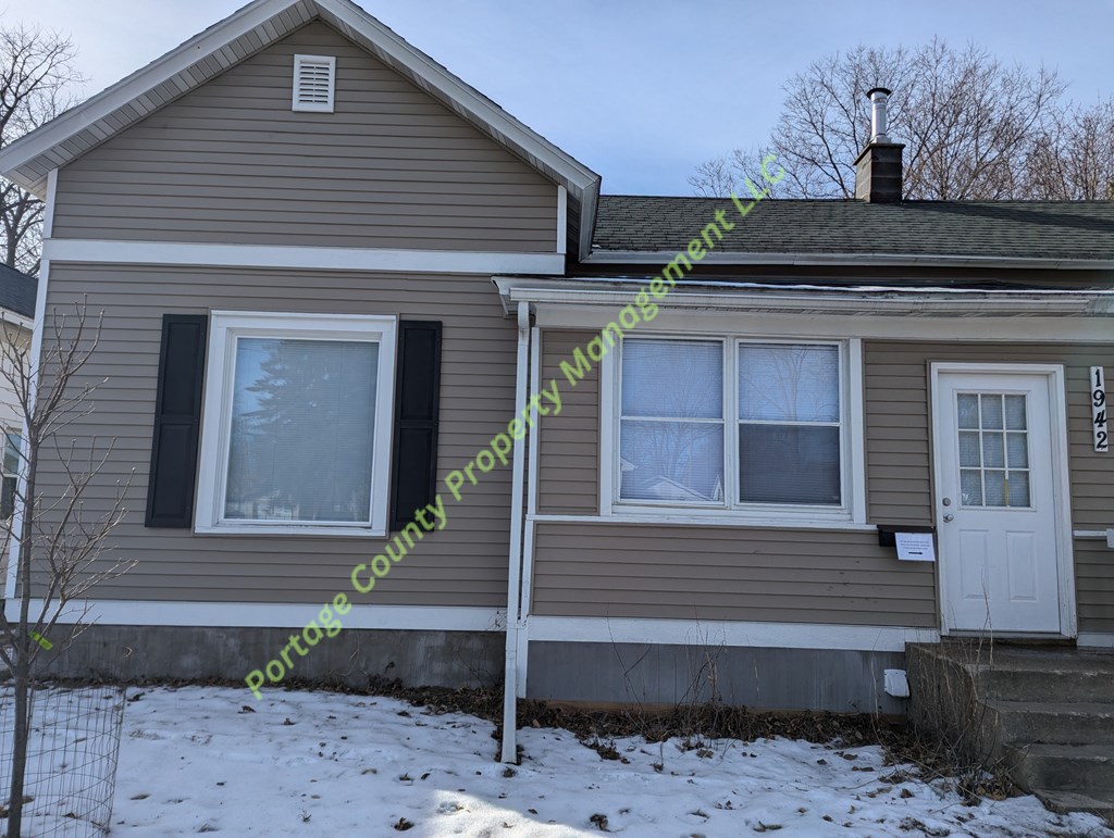 A house with a Portage County Propertymanagement logo.
