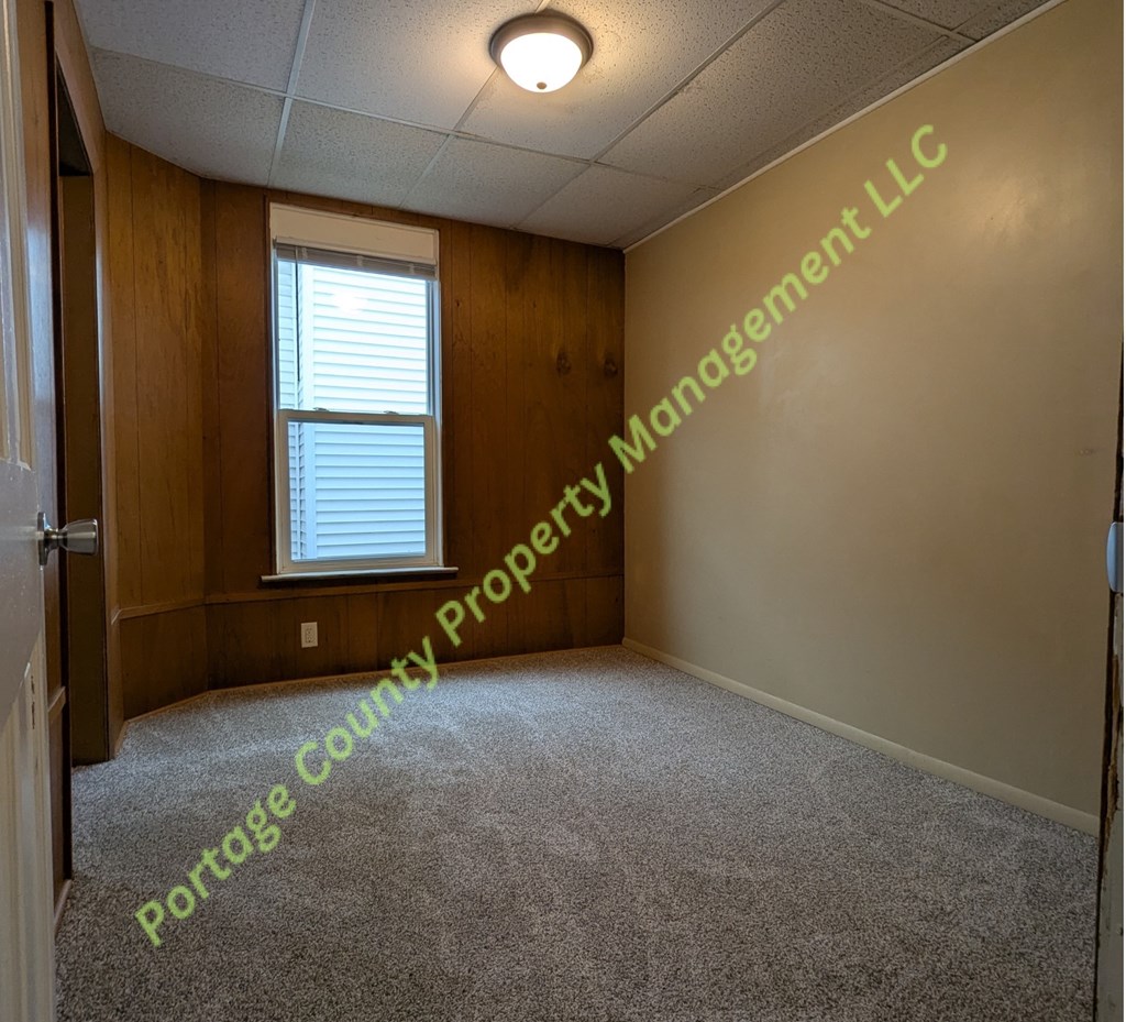 A room with Portage County Property Management LLC written on the wall.