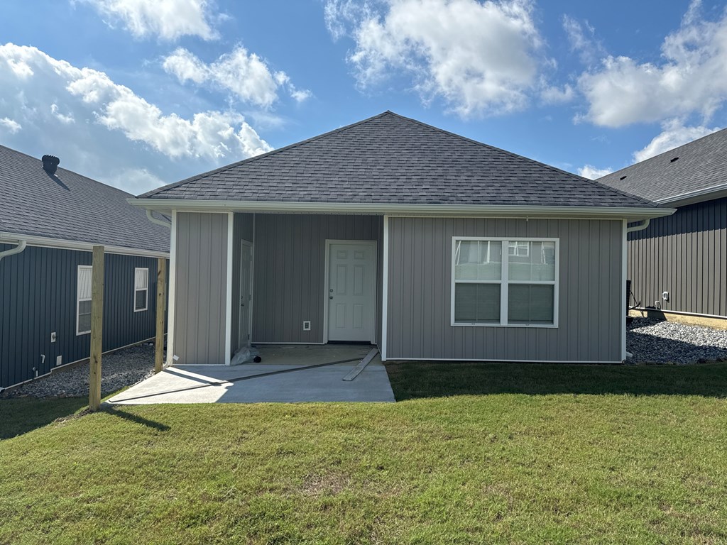 A house with a grey roof and a grey garage door.