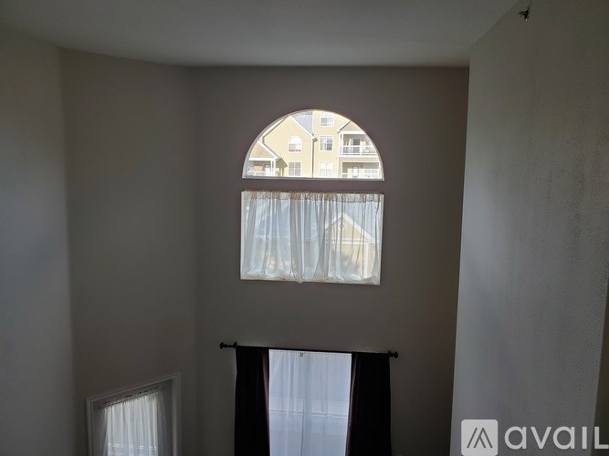 A window with a view of a building outside.